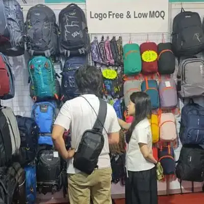 Visitors gathered in front of the SANDA backpack booth