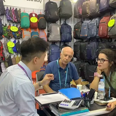 SANDA staff presenting samples to seated buyers at a trade show booth