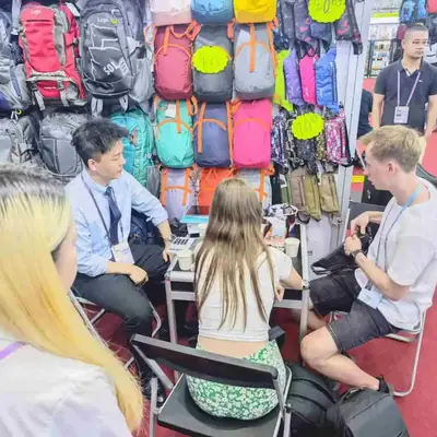 Full view of the SANDA booth and its colourful bag display wall