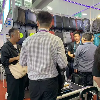 Buyers discussing an order with SANDA staff at the booth counter